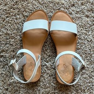 Size 7.5 flat white sandals with gold buckle closure
